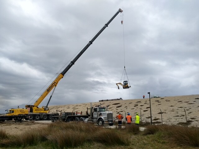 A small excavator was craned onto the SCL pad recently to aid in SCL sampling.
