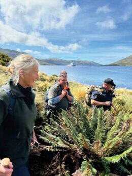 Margaret Christiansen, Bob Bowen and Lt Commander Kerry Driver on Moutere Ihupuku-Campbell Island. Photograph Supplied: Dr Regina Eisert.