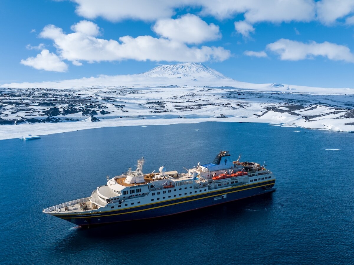 The Heritage Adventurer and Erebus maunga in the background at Cape Royds Antarctica - Photo Credit C. Aitchison, Skyworks UAS