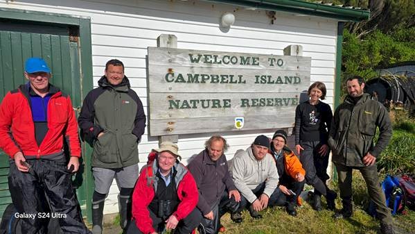 The Ngāi Tahu team at Perseverance Harbour, Campbell Island with Dr Richard Davies (Government House), from left to right: Nigel Finnerty, Riki Parata, Richard Davies, Tony Leith, Ali Harrison, Brian Rance, Vanessa Horwell, Vincient Leith. Photo by Hokonui Rūnanga