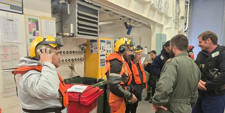 Ali Harrison, Vincient Leith and Tony Leith prepare to deploy via NZDF Sea Sprite helicopter for remote field access. Photo by Hokonui Rūnanga.